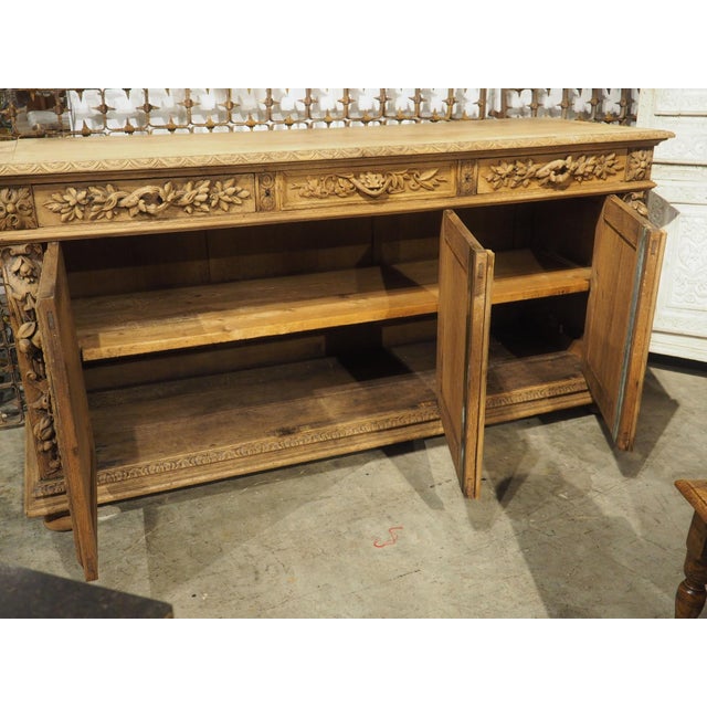 More information coming soon… A richly carved oak enfilade from France, with motifs of hunting and fishing. Hand-carved...