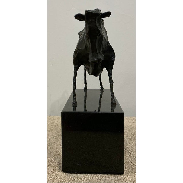 Elie Nadelman, American, 1882 to 1946, greenish brown patina bronze sculpture, Standing Bull. Signed, Elie Nadelman, on...