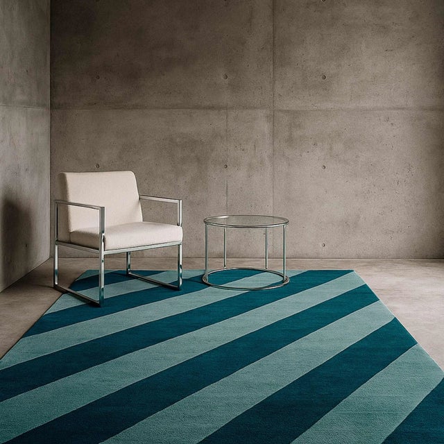 The Sky Blue Rug reflects the vastness of the sky, with stripes in two shades of blue that evoke freedom, lightness, and...