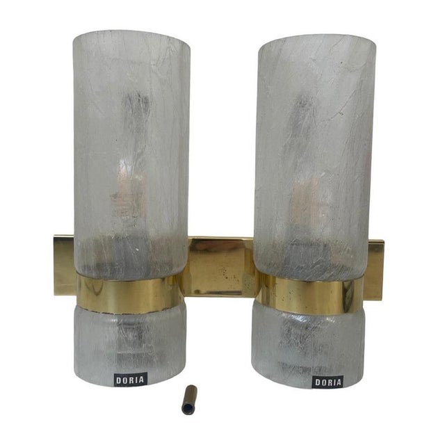 Vintage wall mounted lamp with a shade that is typically 70’s and has a great vibe. Polished brass base and patterned...