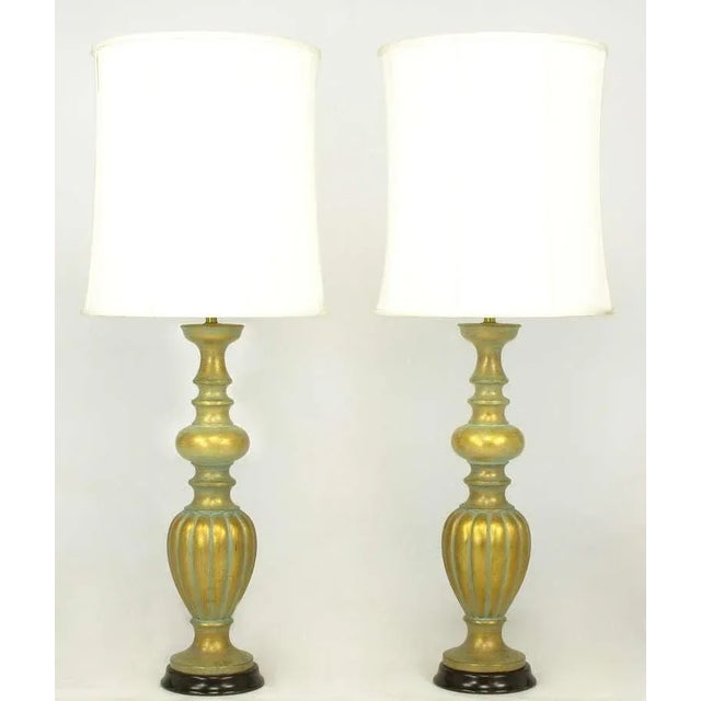 Pair of expertly crafted gilt plaster baluster style table lamps with applied patina. Excellent build quality as they...