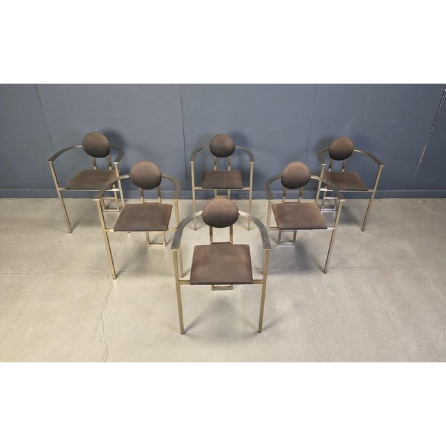 Set of six elegant dining room chairs manufactured by Belgochrom. Nicely designed copper coloured metal frames with...