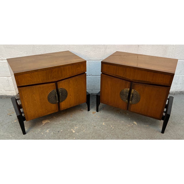 Elevate your bedroom with this exceptional pair of mid-century modern nightstands designed by Helen Hobey for the...
