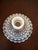 Delightful vintage pair styled after Fenton in luminous blue opalescent glass, including a hobnail candlestick and a...