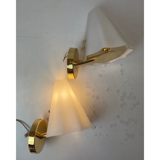 Soft lighted sconces made of a beautiful ‘’encamiciato’’ opaline murano glass lampshade on a polished brass base. Made in...
