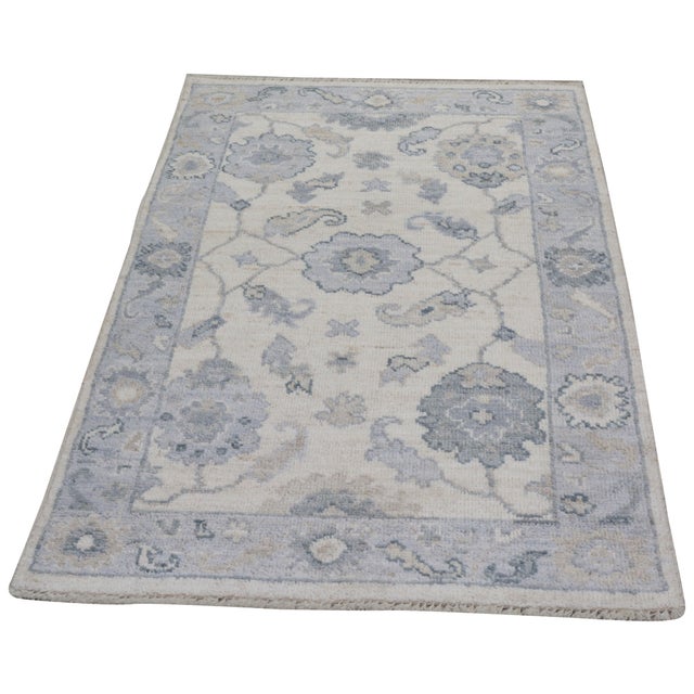 Turkish Oushak Hand-knotted with care using traditional rug-making techniques, this wool rug blends timeless craftsmanship...