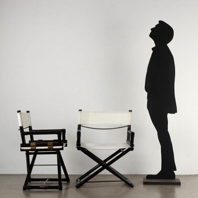 Set of 4 folding 'director's' chairs, bamboo frame, fabric seat and back. This piece is attributed to the mentioned...