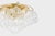Swirl-ribbed or plated champagne glass globes dangle from an Aged Brass frame, creating this cloud-like showstopper....