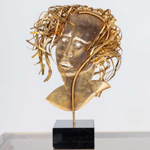 Busts of Romeo and Juliet made of embossed and gilded copper. Romeo is depicted in the form of a bearded man with curly...