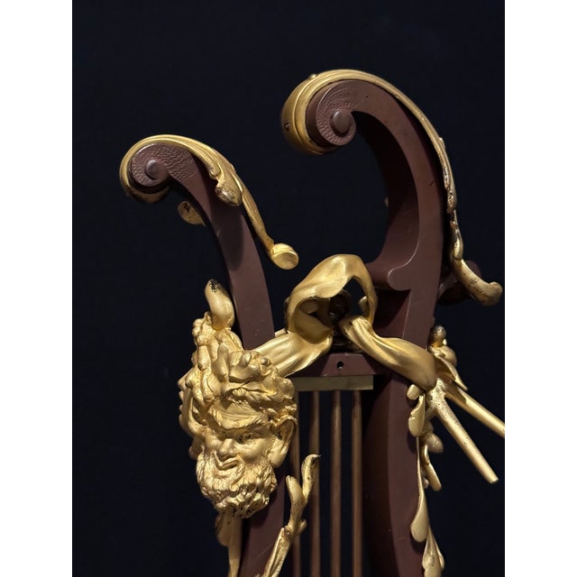 An exquisite mid-19th-century French Louis XVI-style bronze lyre clock, dating from approximately 1840–1860. Designed in...