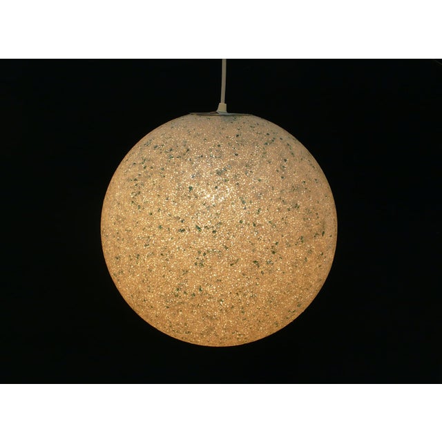 1960s/70s globe pendant lamp made of plastic granules with green shards scattered throughout. A truly beautiful lamp. it...