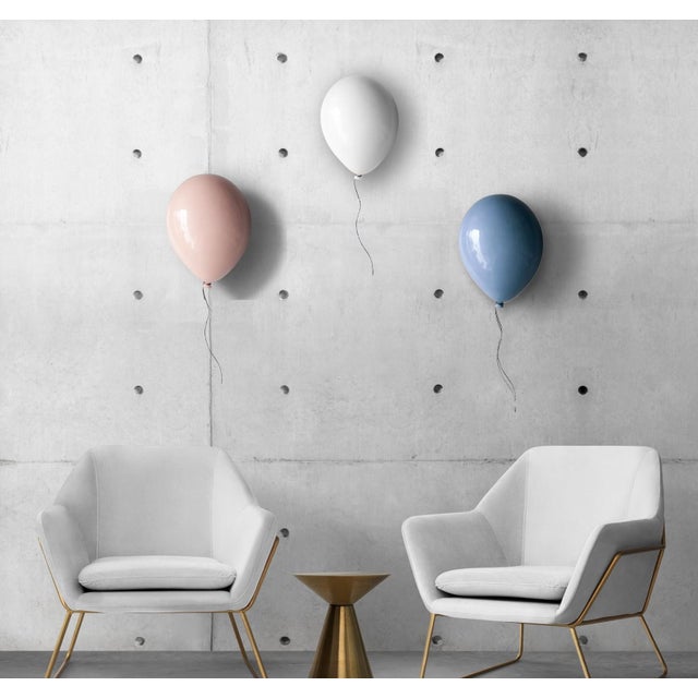 Glossy White balloon sculpture for wall or ceiling installation. Handcrafted from clay by ArtArsouf Clay Luxury Design...