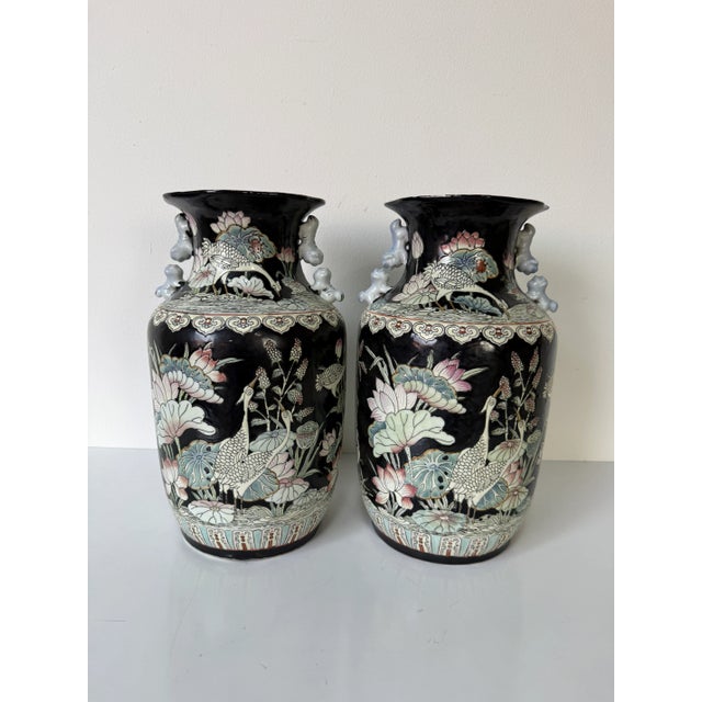 Exquisite pair of vintage Chinese hand-painted porcelain vases featuring an elegant and intricate depiction of cranes...