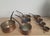 The loop-end iron handles are the tell. This is not decorative copper — these are professional French kitchen pots built...