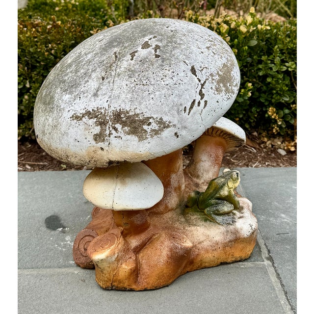 Cast composition stone mushroom cluster with frog—great scale and strong garden presence. A cast composition stone...