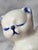Two ceramic cats, glazed in floral blue and white. Mom and kitten are resting sweetly. Beautiful simple style that makes a...