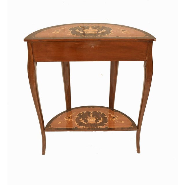 Elegant pair of french louis xv style side tables decorated with fine floral marquetry the serpentine shaped tops are...