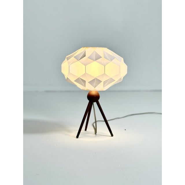 Lars Schiøler – Table Lamp, Denmark, 1960s The Facett shade designed by Lars Schiøler crowns this stunning teak-based...