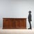 Baroque walnut sideboard, constructed with period wood. A pair of drawers under the top, four front doors, and paneled...