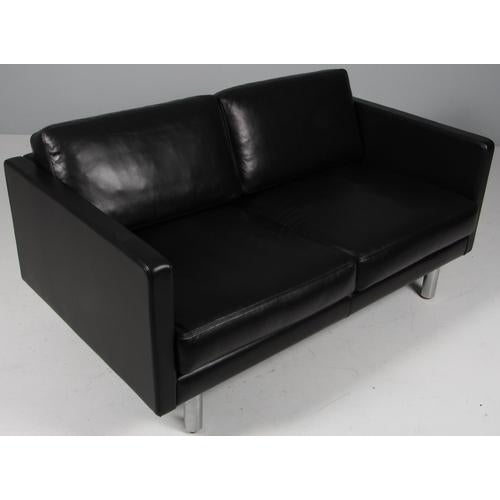 Erik Jørgensen two-seat new upholstered with black pure full grain aniline leather. Legs of steeæ. Model 220, made by Erik...