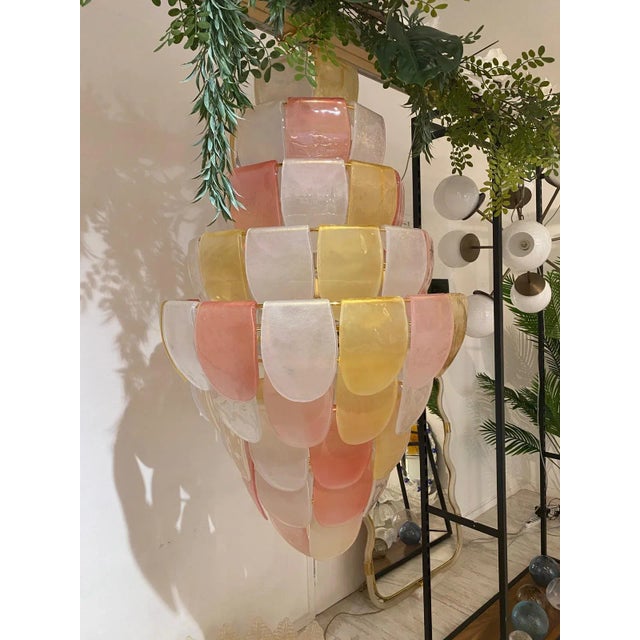 Luxury modern chandelier with sanded pink and amber ”Petals” in Murano glass . Hand-made in Murano glass , all made in...