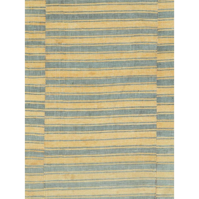 A vintage Turkish Flatweave Kilim accent rug handmade during the mid-20th century with a flannel design in pale straw...