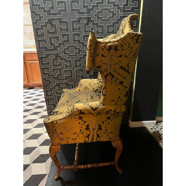 Dramatic late 1800’s exagerated scroll wingback chair. Newly reupholstered in a stunning silk blend Damask. Medieval,...