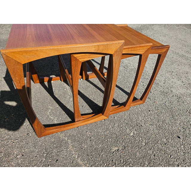 Mid-Century Modern Teak set of three nesting tables by G Plan "Quadrille" collection. Largest: 19.25"H x 20 7/8" W x 17"D...