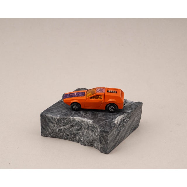 Original vintage die cast model of the Tanzara from Matchbox, Series No. 53, mounted on a solid marble base. A unique, one...