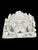 A substantial architectural lion head wall plaque or fountain mask, richly modelled with the lion’s face emerging from an...