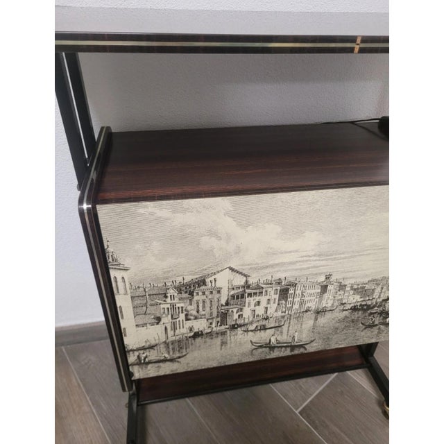 Mid-century Formica bar cabinet. Excellent overall condition, with minor signs of wear. The item is equipped with internal...