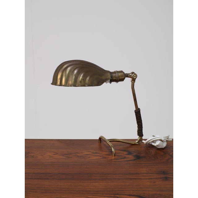 Beautiful brass Art Deco table lamp / desk lamp, France 1920s / 1930s. The shade is adjustable and has a lovely shell...