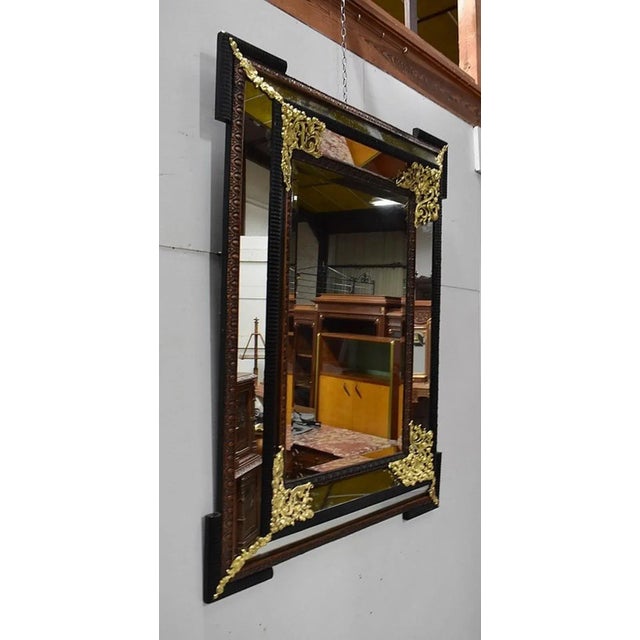 Large Rectangular Faceted Mirror, with bevelled edge in the middle. The tower mirrors form a wide projecting frame. It is...