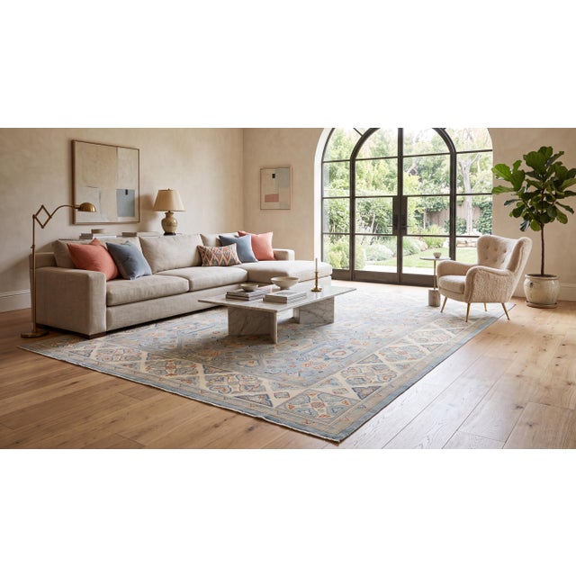Elevate your interior with this exquisitely crafted modern hand-knotted wool area rug, designed with a sophisticated blend...