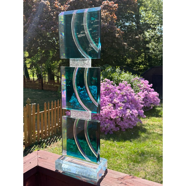David Muñiz Lucite Acrylic Art Sculpture, signed and dated for 2002. The piece is comprised of vibrantly colored turquoise...