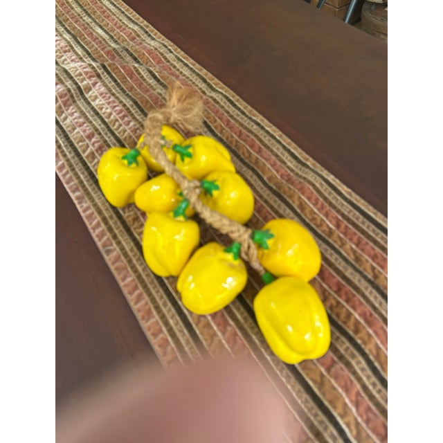 Made in Italy, a very realistic bunch of yellow bell peppers on a heavy rope for kitchen or restaurant display.
