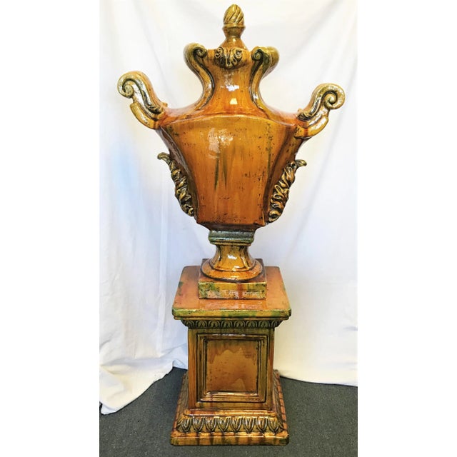 Wow! This is a stunning Italian ceramic large lidded urn on a pedestal base. It is finished in a gorgeous golden ochre...