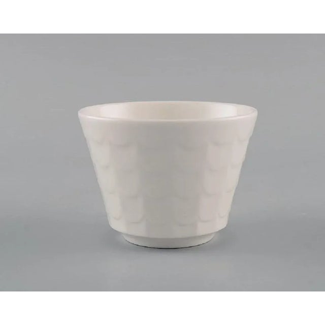Wilhelm Kåge for Gustavsberg. Eight cups in white glazed porcelain. Swedish design, 1960s. Measures: 8 x 6 cm. In...