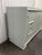 Offered is a vintage solid wood credenza. This piece features three dovetailed smooth gliding drawers, pair of cabinet...