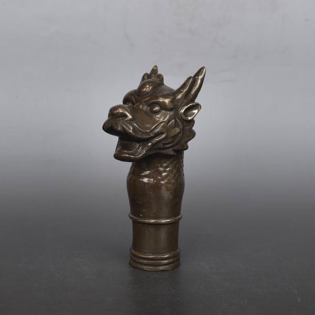 This is a finely cast vintage Chinese pure silver cane handle, shaped as the head of a mythical dragon from the Chinese...