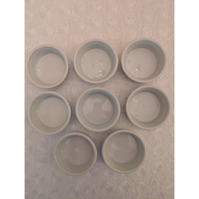 Set of eight BIA Cordon Bleu two-ounce porcelain ramekins each measuring about 2-5/8" wide by 1-1/8" high. These small...