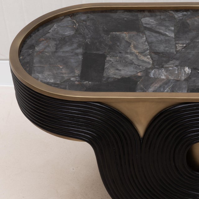 The Licol Side Table is a testament to the artistic finesse of R&Y Augousti, combining the raw beauty of black quartz with...