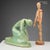 Cast ceramic sculpture in shades of green depicting 'The Reaper'. The work does not have the manufacturer's mark. This...