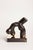 A contemporary figurative bronze of the female body, abstracted into a single arched, flowing form. The artist reduces the...