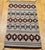 A beautifully woven vintage Navajo rug from the third quarter of the 20th century, this textile showcases a bold banded...