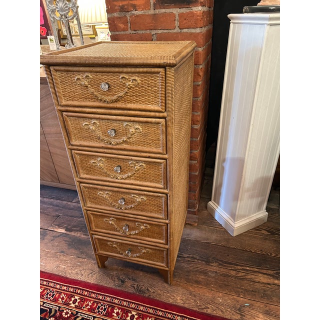 Antique Nantucket wicker chest of drawers having wonderful faded brown color and garland raised wood decoration on each of...