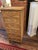 Antique Nantucket wicker chest of drawers having wonderful faded brown color and garland raised wood decoration on each of...