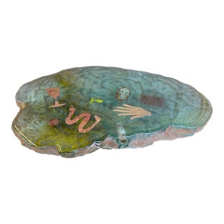 Vintage Cast Sculptural Art Piece With Embedded Figural Motifs and Textured Base For Sale