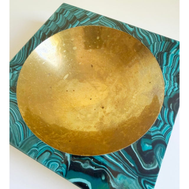A richly finished square vide-poche or ashtray with a deep, round well. Design by Aldo Tura, circa 1960s, Italy. The piece...