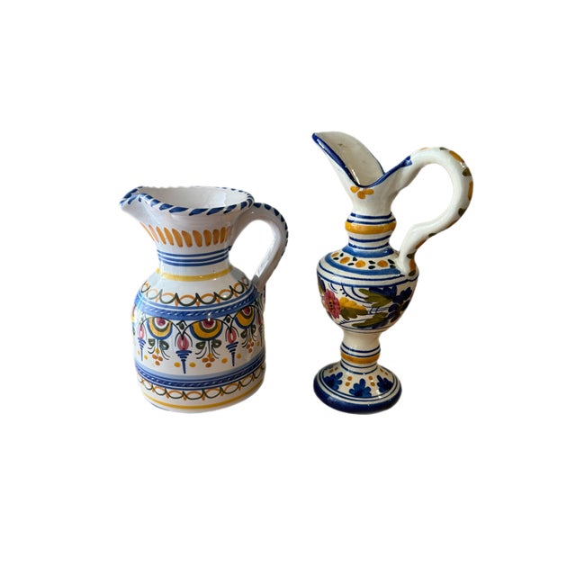 A character-rich pair of mid-to-late 20th century hand-painted Spanish ceramic ewers in a traditional Andalusian palette...